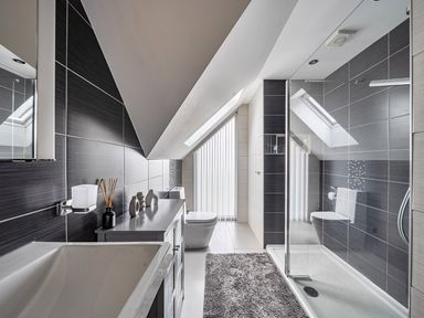 A bathroom with a sink, bath tub, shower, and toilet at 5 Bed House, Sleeps 14 with Hot Tub and Bar in Tavistock