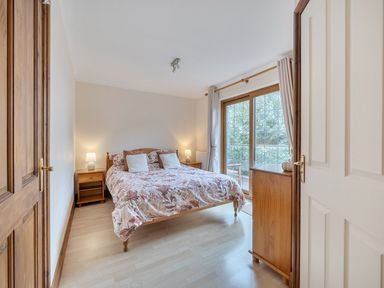 A bedroom with a bed and side tables at 2 Bed, Sleeps 4 with Parking and EV charging, Wadebridge