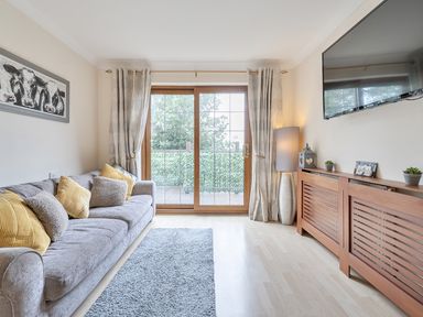 A living room with a sofa and television at 2 Bed, Sleeps 4 with Parking and EV charging, Wadebridge