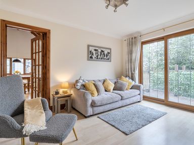 A living room with a sofa and armchair at 2 Bed, Sleeps 4 with Parking and EV charging in Wadebridge