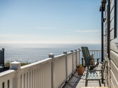 A deck with chairs and a view of the sea at 2 Bed Caravan, Sleeps 4 with Sea Views, West Lulworth