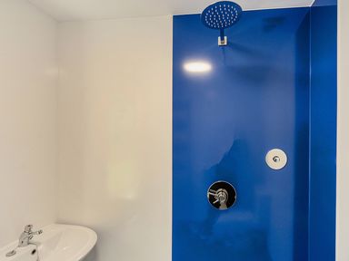 A bathroom with a shower and sink at Yurt, Sleeps 2 with BBQ and Fire Pit, Tregooden Farm near St Tudy