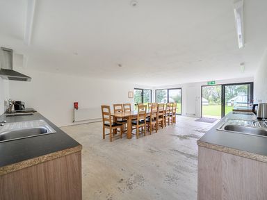 A kitchen with a dining table and chairs at Yurt, Sleeps 5 and Dogs Welcome