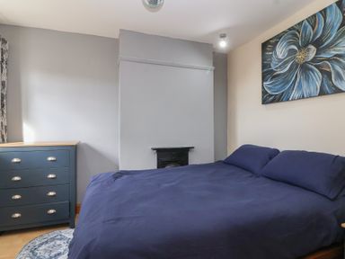 A bedroom with a bed and dresser at 19 Hailey Road