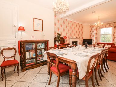 A dining room with a table set for dinner at Craig Y Glyn