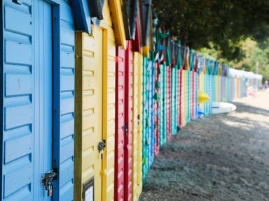 A row of colorful beach huts at Craig Y Glyn Cottage in Pwllheli