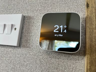 A thermostat displaying temperature and a light switch at Hafan y Mor - 159 Snowdonia Pwllheli