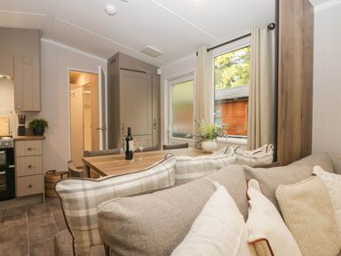 A kitchen with dining area and soft seating at Lake It Easy in Troutbeck Bridge