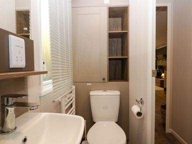 A bathroom with a sink and toilet at Lake It Easy in Troutbeck Bridge