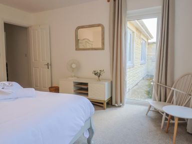 A bedroom with a bed and furniture at Bay View in Weymouth
