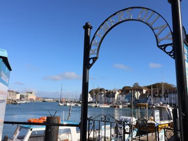 A view of the marina with boats and buildings at Brewers Quay in Weymouth
