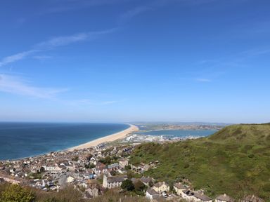A coastal view of houses and the sea at Bay View in Weymouth