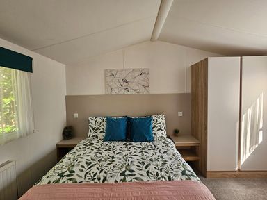 A bedroom with a bed and nightstand at The Old Barn in Manchester