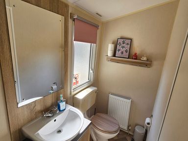 A bathroom with sink and toilet at the property