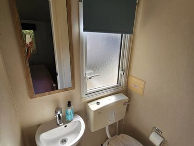 A bathroom with a sink and toilet at the property