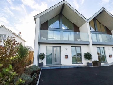 A house with a front entrance and balcony at 1 Endellion View Wadebridge