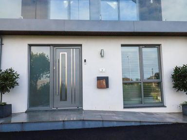 A front entrance with a door, window, and mailbox at 1 Endellion View Wadebridge