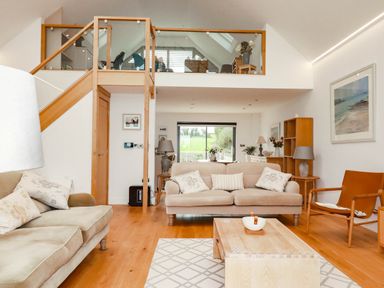 A living room with a sofa and coffee table at 1 Endellion View Wadebridge