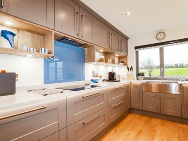A kitchen with cabinets and a sink at 1 Endellion View Wadebridge