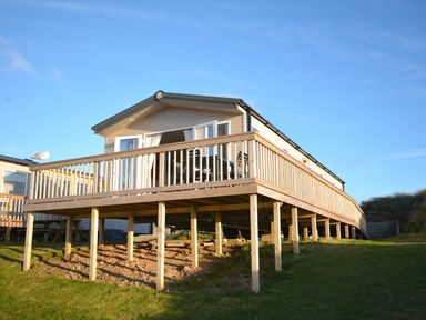 A holiday home with decking and outdoor seating at Perran Sands Holiday Park - 621 Chy-an-Mor Perranporth