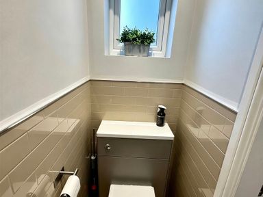 A bathroom with a toilet and sink at Jacks Place in Whitby