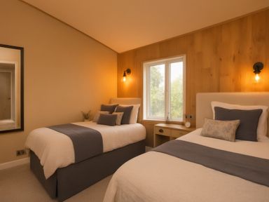 A bedroom with two beds and a window at Hoburne Devon Bay - Woodland Glade 24, Paignton