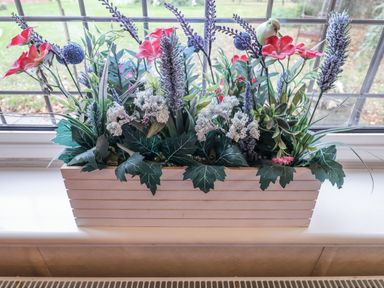 A flower arrangement in a pot on a window ledge at The Lodge Old Buckenham near Attleborough