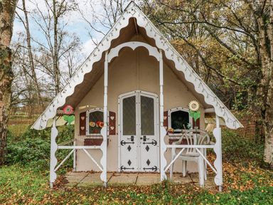 A small house with garden furniture outside at The Lodge in Old Buckenham near Attleborough