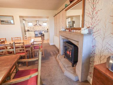 A dining room with a table and chairs at Ghyll Bank House Staveley near Windermere