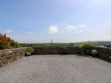An outdoor area with a gravel surface and plants at The Stall near Penuel Llanmorlais