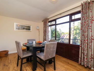 A dining area with a table and chairs at Violet Lodge in Saltburn-by-the-Sea