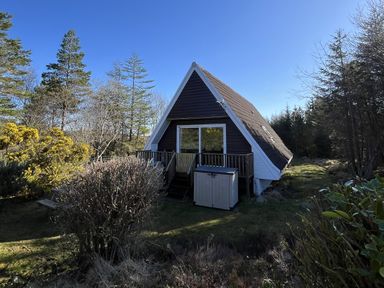 A house with deck and storage shed in the garden at Suil Na Mara Aultbea