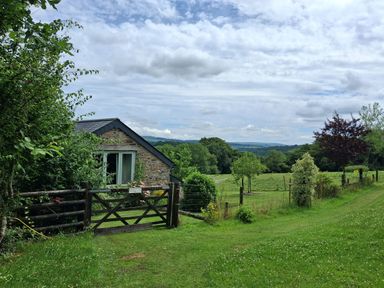 A house with a gate and fence at Woodstone Barn Whitchurch near Tavistock