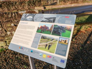An informational sign about Lanercost and Hadrians Wall at Hadrians View in Banks near Brampton
