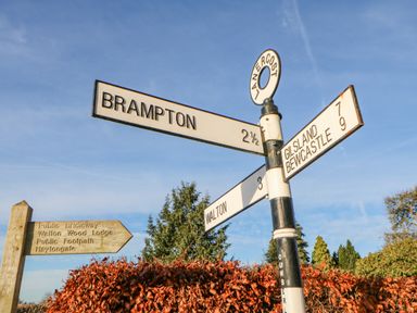 A signpost with directions to Brampton Walton Gilsland and Bewcastle at Hadrians View in Banks near Brampton