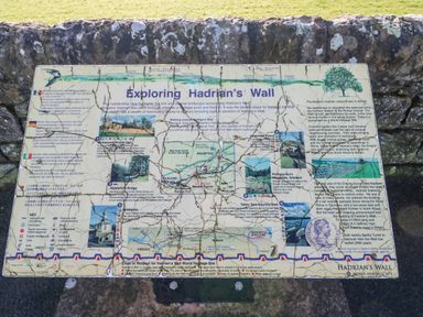 An informational sign about exploring Hadrian's Wall with maps and text at Hadrian's View in Banks near Brampton