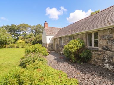 A house with a garden and pathway at Swallows in St Keverne, Lizard Peninsula