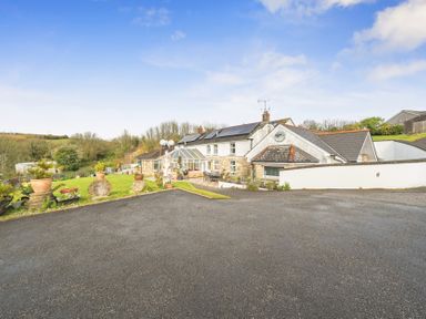A house with garden and driveway at Chapel Green in Polgooth