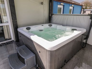 A hot tub with steps at Meadow View in Laugharne