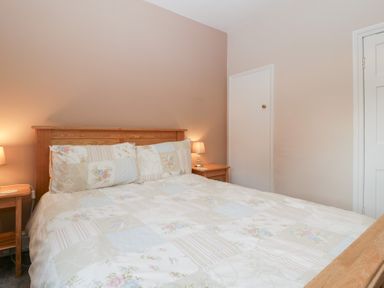 A bedroom with a bed and bedside tables at The Croft in Vowchurch near Peterchurch