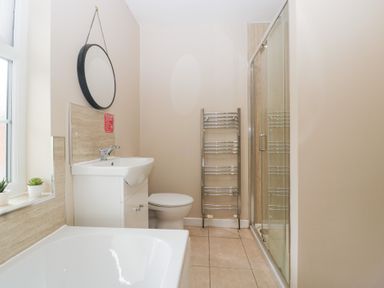 A bathroom with a sink, shower and bathtub at The Croft in Vowchurch near Peterchurch