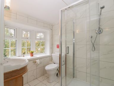 A bathroom with a shower and sink at The Croft in Vowchurch near Peterchurch