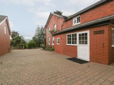 The entrance of a property with a paved driveway at The Croft in Vowchurch near Peterchurch