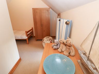 A bedroom with a bed and furniture at Bwthyn Trecoed St. Clears near Carmarthen