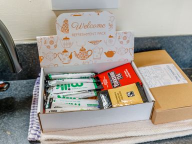 A welcome refreshment pack with tea bags and coffee sachets on a kitchen counter at Perriwinkle in The Bay near Filey