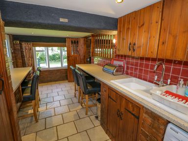 A kitchen with a sink and cabinets at Severn Bank Lodge in Astley Burf near Stourport-on-Severn