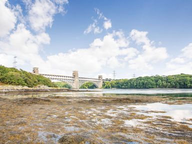 A bridge over a body of water with trees on both sides at Menai View in Llanfairpwllgwyngyll near Beaumaris
