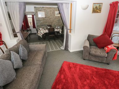 A living room with seating area and dining space at Maesgwyn in Bridell near Cardigan