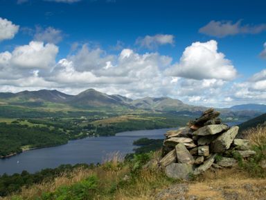A landscape with a lake hills and a pile of rocks at Browside in Little Arrow near Coniston