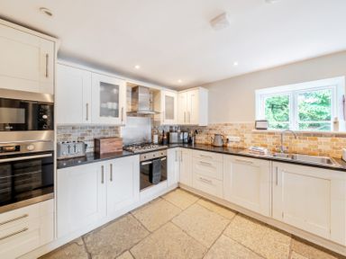 A kitchen with appliances and countertops at Hammerhole at the Graythwaite Estate near Hawkshead
